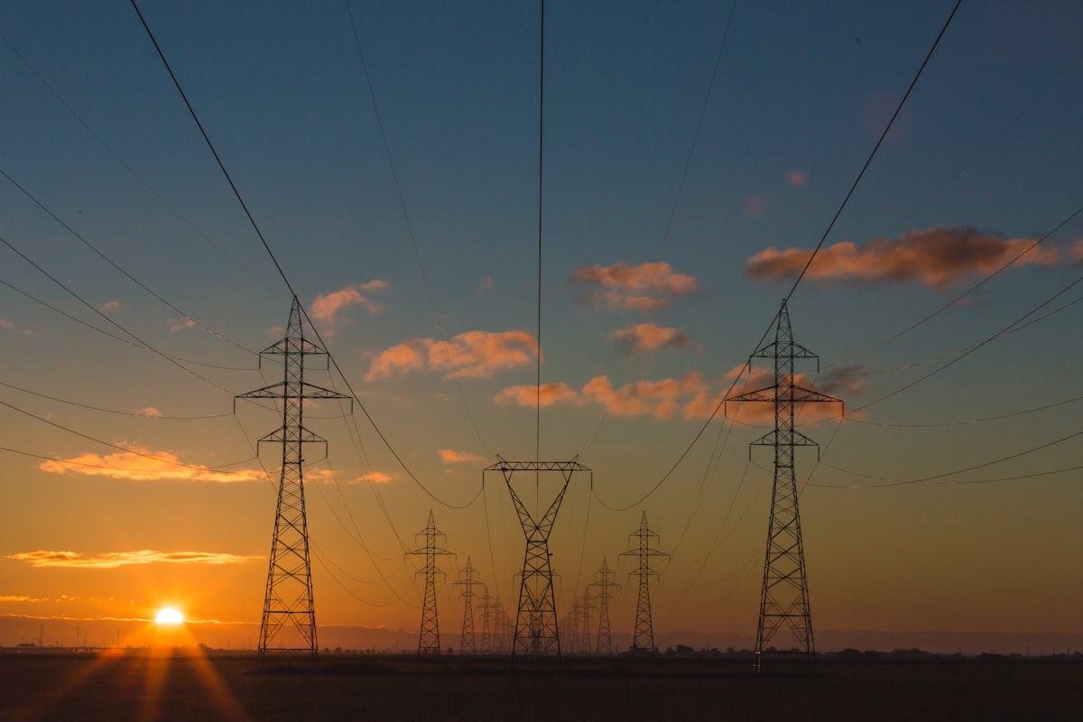 UK electricity transmission towers at dusk